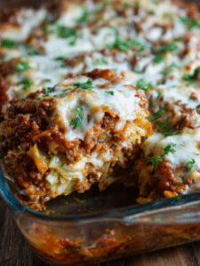 Cabbage roll casserole baked in white dish with visible beef and cabbage layers